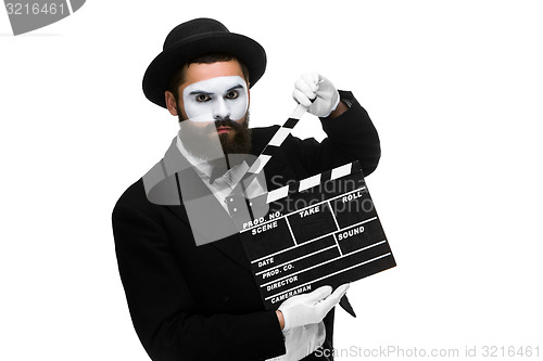 Image of man in the image mime with movie board