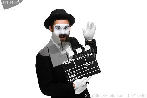 Image of Joyful man in the image mime with movie board