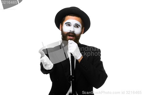 Image of portrait of a man as mime with tube or retro style microphone