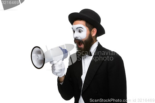 Image of Man with a face mime screaming into megaphone 