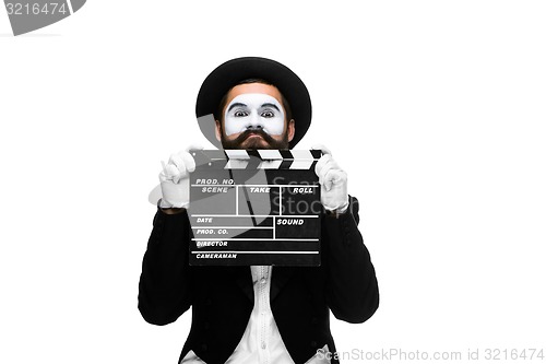 Image of man in the image mime with movie board