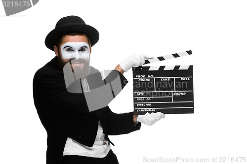 Image of man in the image mime with movie board