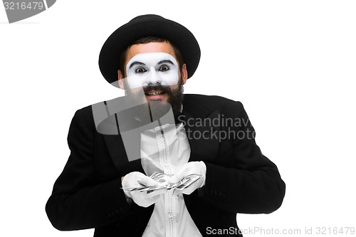 Image of mime as businessman holding money