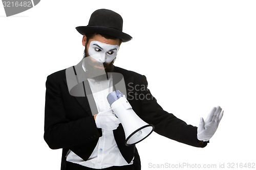 Image of Man with a face mime screaming into megaphone 