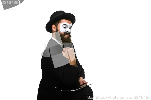 Image of Mime as businessman has stress because of computer problem. 