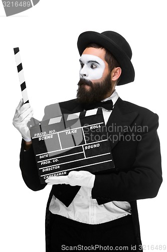 Image of man in the image mime with movie board