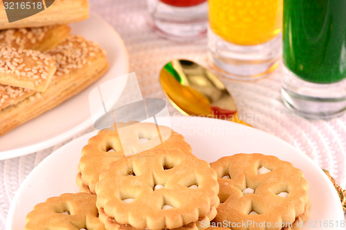 Image of sweet cake on white plate and juice