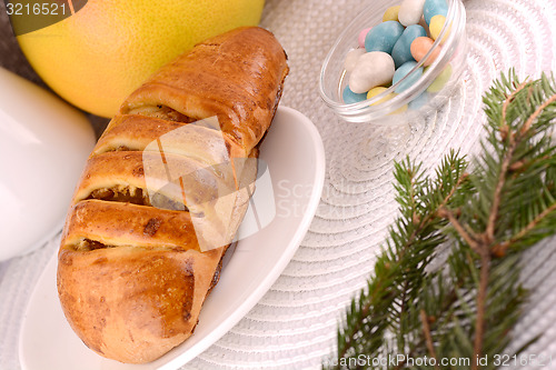 Image of sweet cake on white plate and fruits