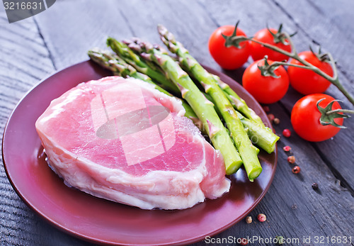 Image of raw meat and asparagus