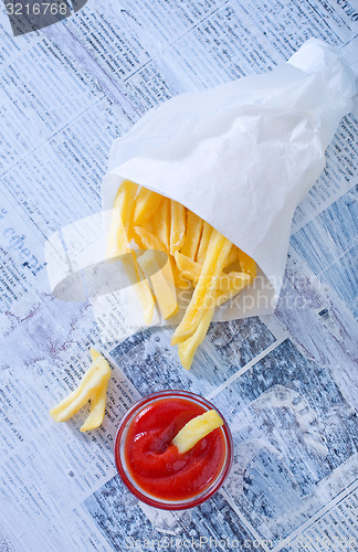 Image of potato with ketchup