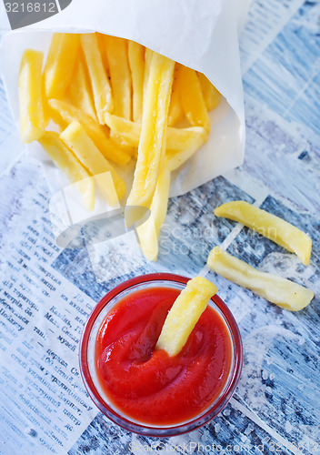 Image of potato with ketchup