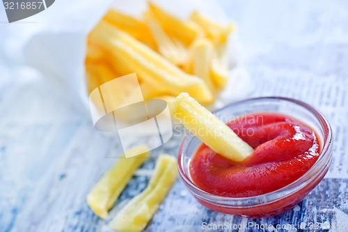 Image of potato with ketchup