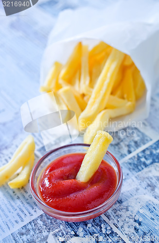 Image of potato with ketchup