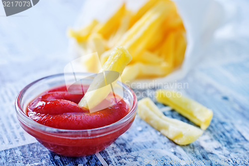 Image of potato with ketchup