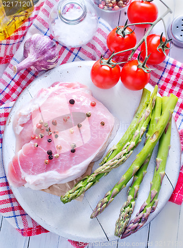 Image of raw meat and asparagus