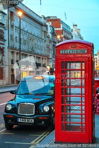 Image of Famous red telephone booth and taxi cab in London