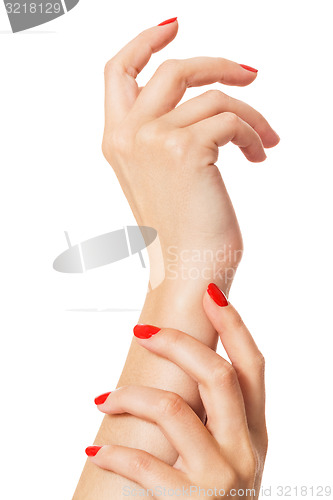 Image of Woman with beautiful manicured red fingernails