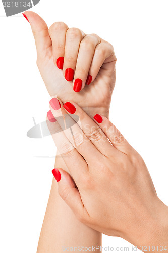 Image of Woman with beautiful manicured red fingernails