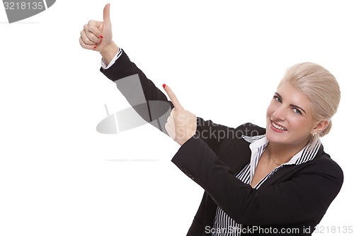 Image of Businesswoman Pointing Up While Looking at Camera