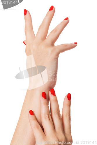 Image of Woman with beautiful manicured red fingernails