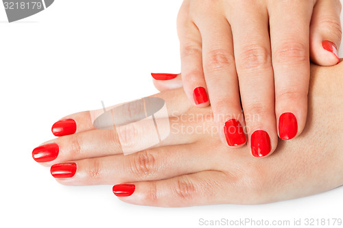 Image of Woman with beautiful manicured red fingernails