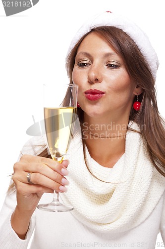 Image of Playful woman celebrating Xmas blowing a kiss