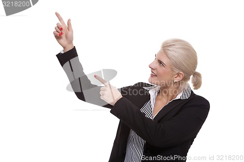 Image of Businesswoman Pointing Up While Looking at Camera