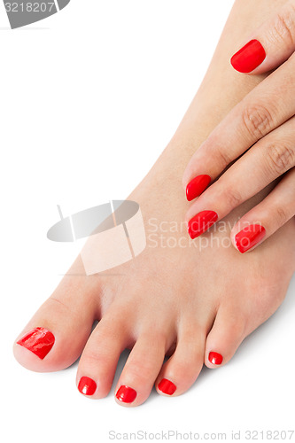 Image of Woman with beautiful red finger and toenails