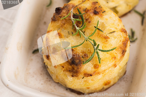 Image of potato gratin with fresh rosemary