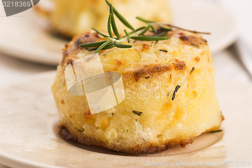 Image of potato gratin with fresh rosemary