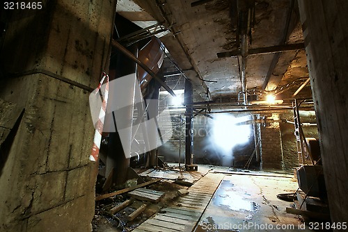Image of Old creepy, dark, decaying, destructive, dirty factory