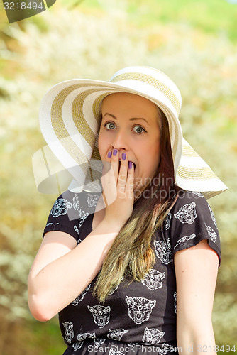 Image of Grimace portrait of cheerful fashionable woman with hat