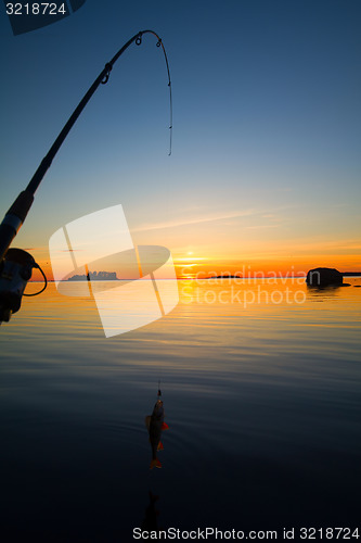 Image of Sunset river perch fishing with the boat and a rod