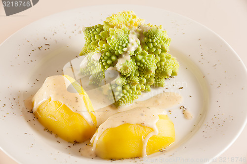 Image of Romanesco with boiled potatoes and cheese sauce