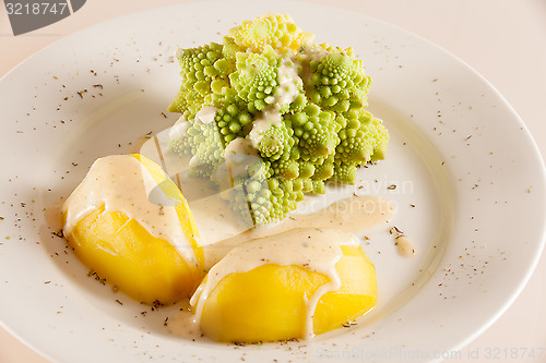 Image of Romanesco with boiled potatoes and cheese sauce