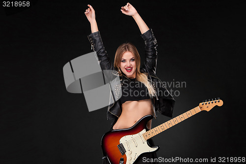 Image of Beautiful girl playing guitar