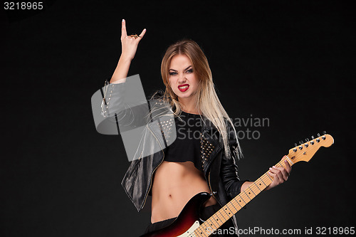 Image of Beautiful girl playing guitar