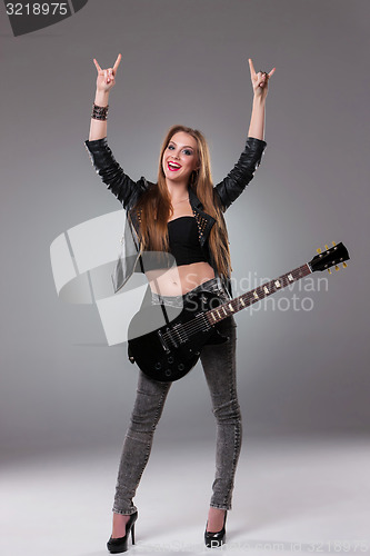 Image of Beautiful girl playing guitar