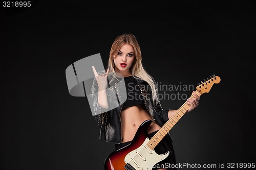 Image of Beautiful girl playing guitar