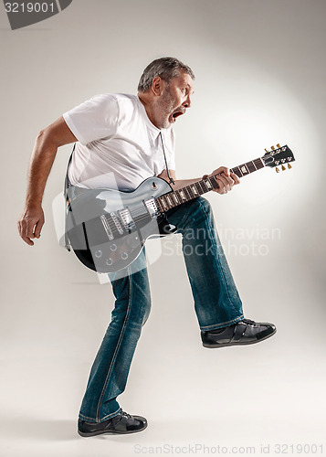 Image of Full length portrait of a guitar player 