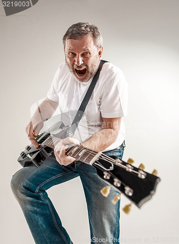 Image of portrait of a guitar player 