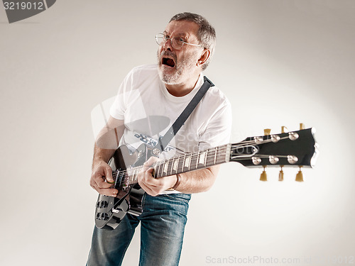 Image of portrait of a guitar player 