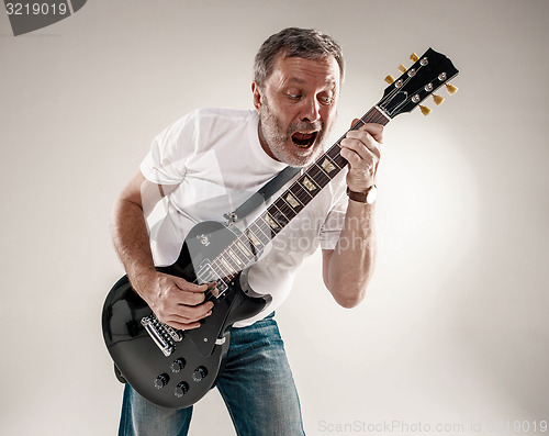 Image of portrait of a guitar player 