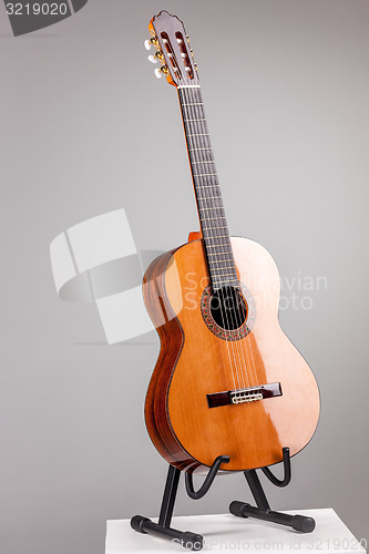 Image of Isolated on gray acoustic guitar