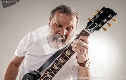 Image of portrait of a guitar player 