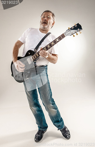 Image of Full length portrait of a guitar player 