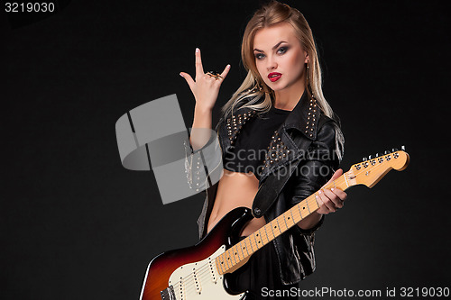 Image of Beautiful girl playing guitar