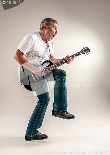 Image of Full length portrait of a guitar player 