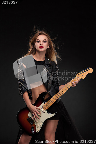 Image of Beautiful girl playing guitar