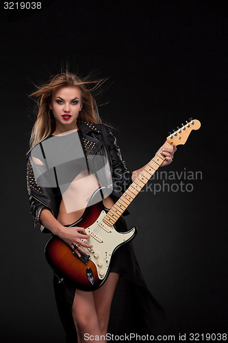 Image of Beautiful girl playing guitar